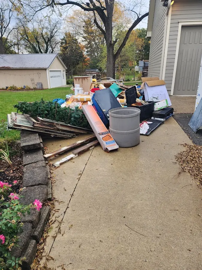 Dumpster being loaded with debris for 3 Yard Dumpster Rental in Lake Wisconsin